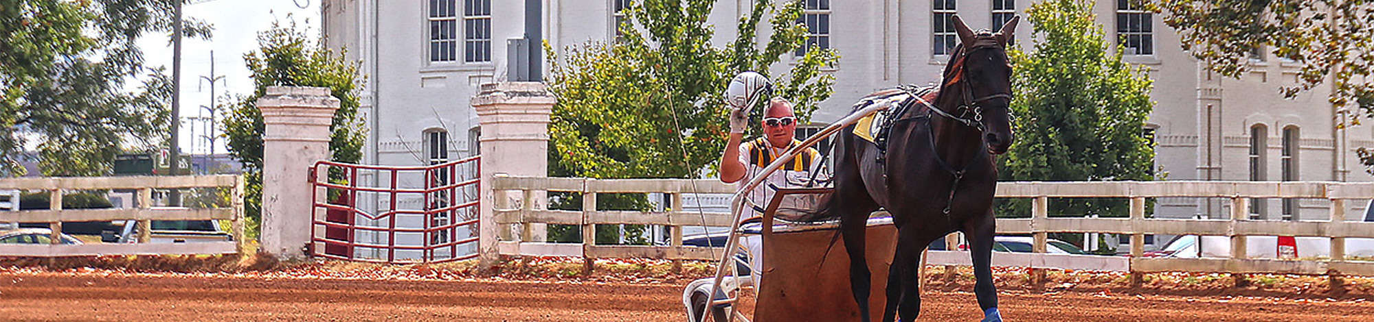 Driver tipping his helmet