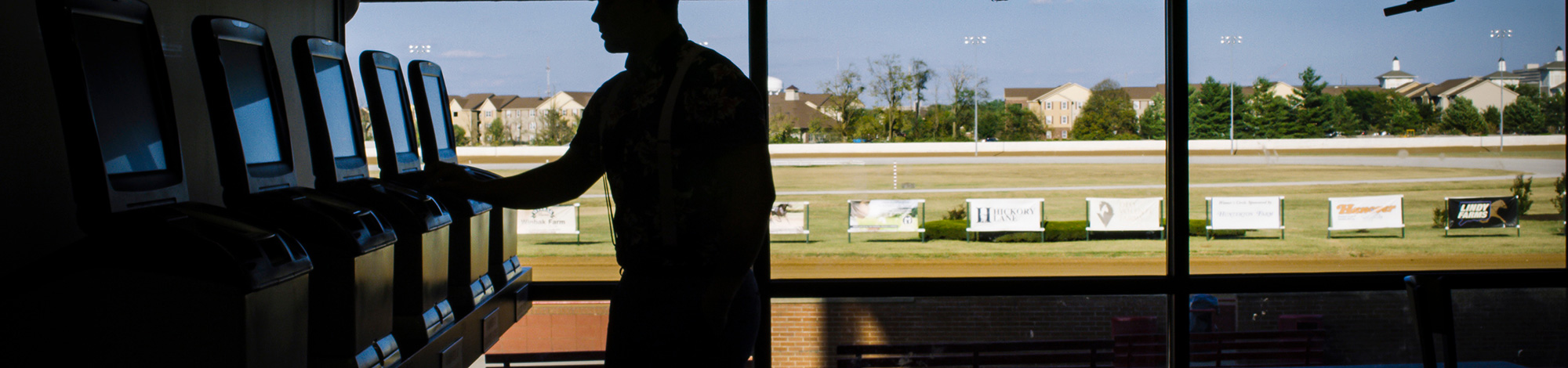 Silhouette of man placing a wager